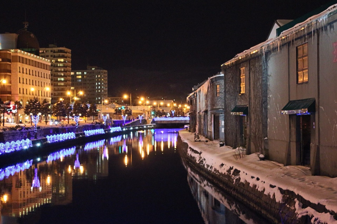 The Otaru canal in Hokkaido at night, snow on the warehouse roofs